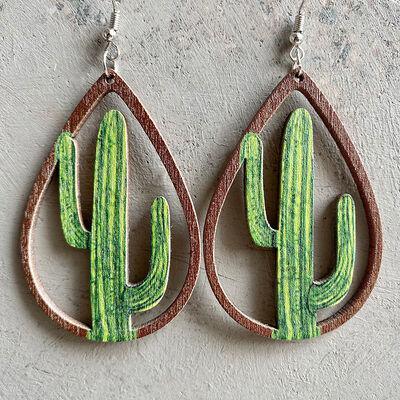 a pair of earrings with a green cactus inside of it