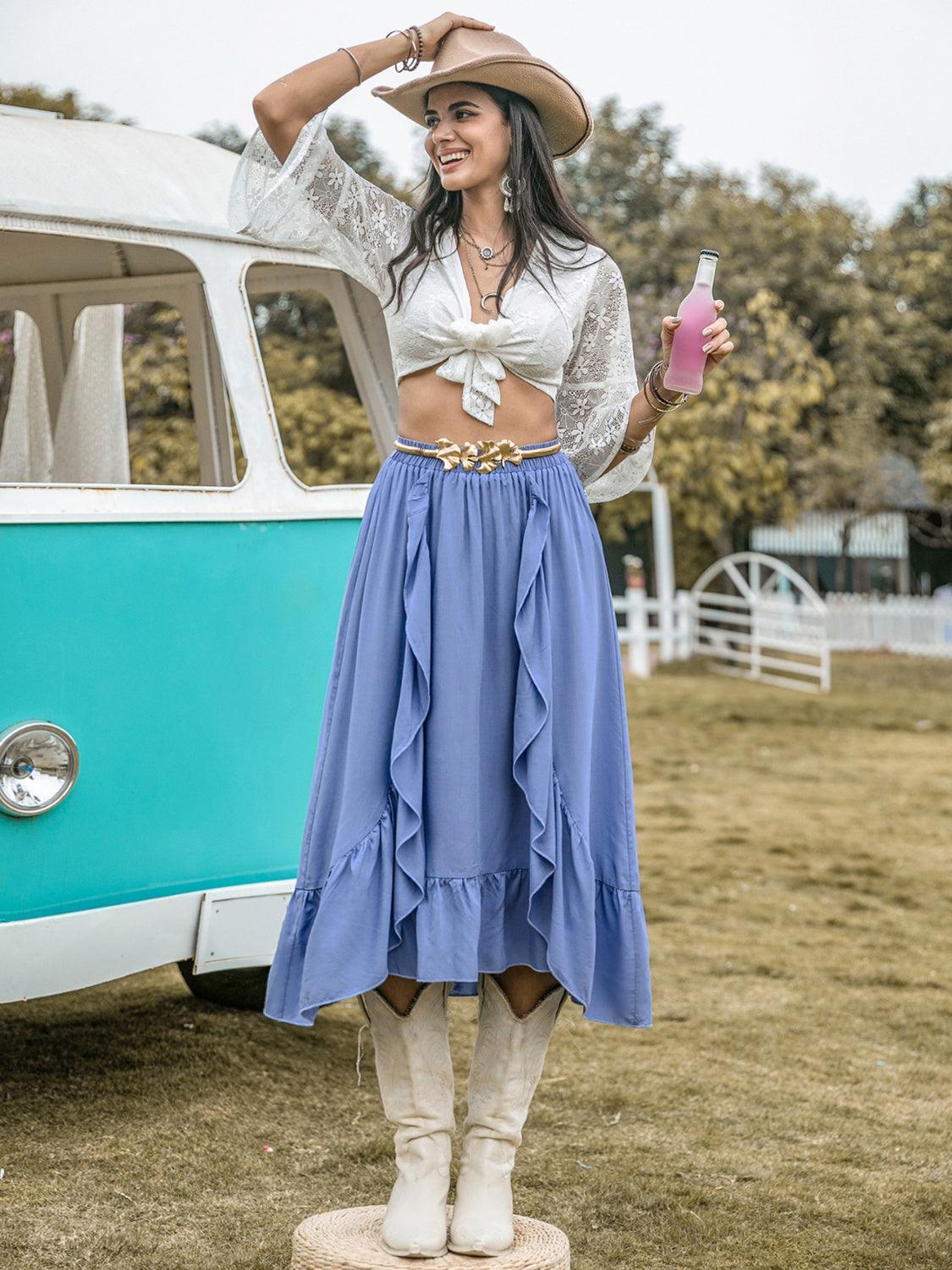 a woman standing in front of a vw bus