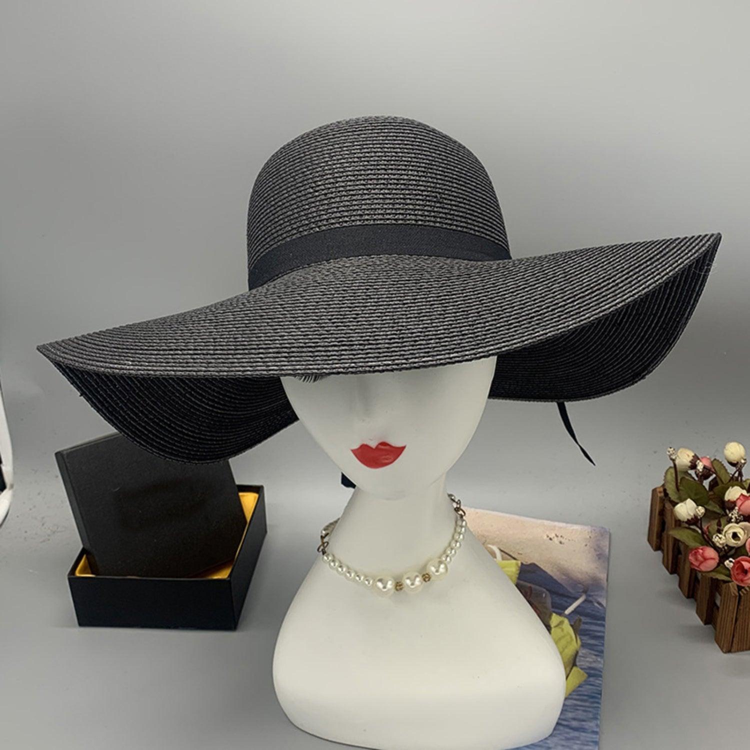 a white mannequin head wearing a black hat