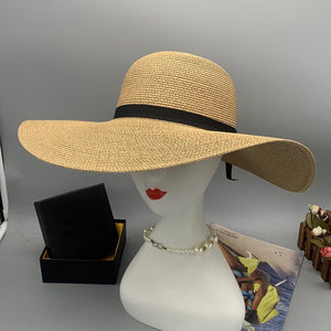 a white mannequin head wearing a straw hat