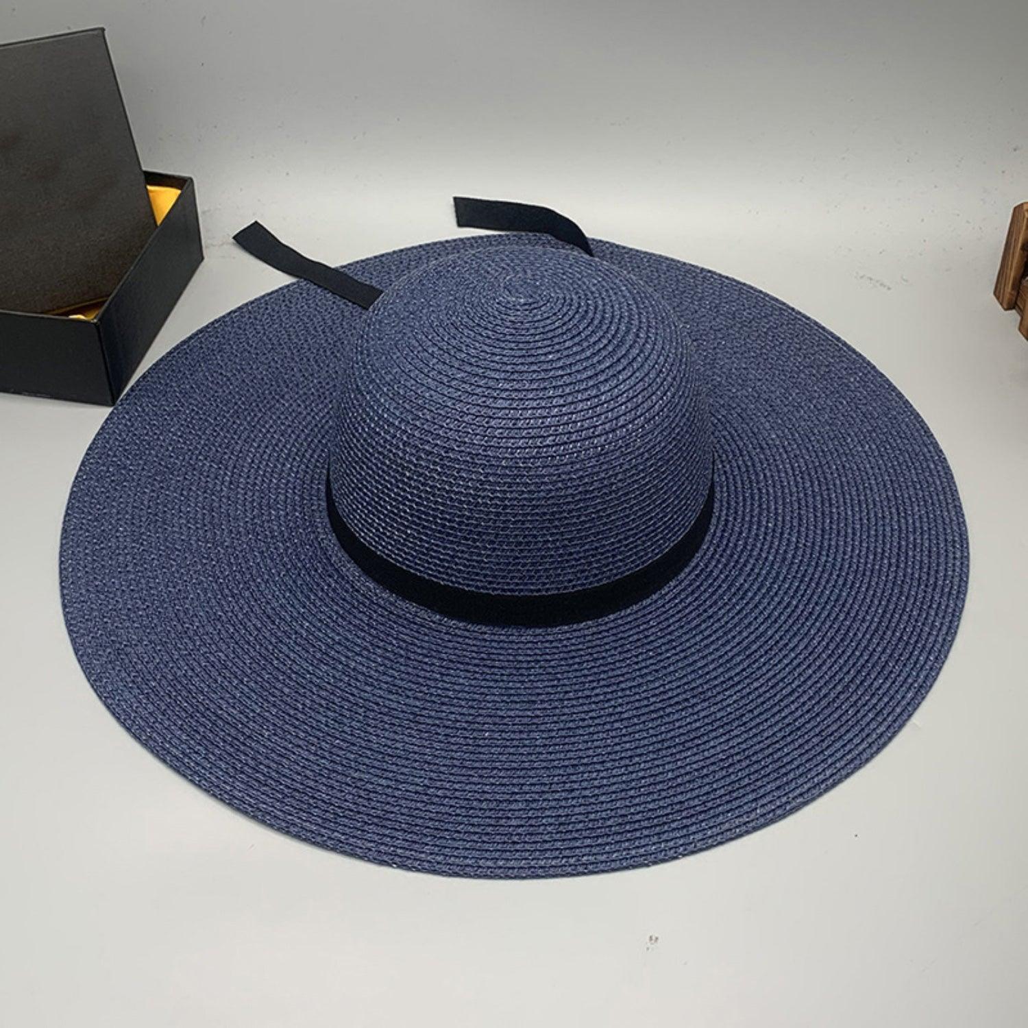 a blue hat sitting next to a box