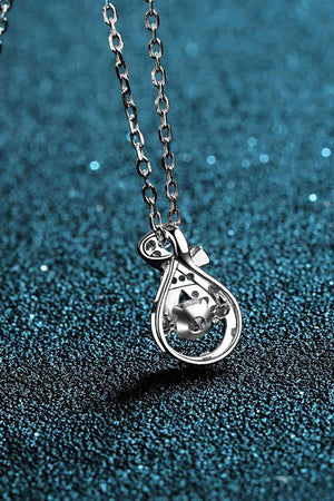 a silver necklace with a heart on it