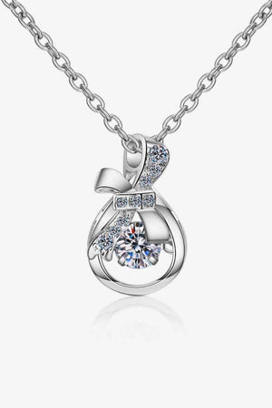 a necklace with a diamond on it