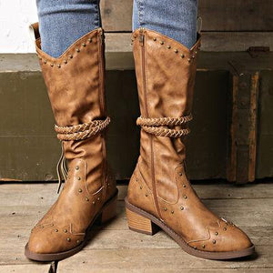 a pair of brown boots with a rope around the ankles