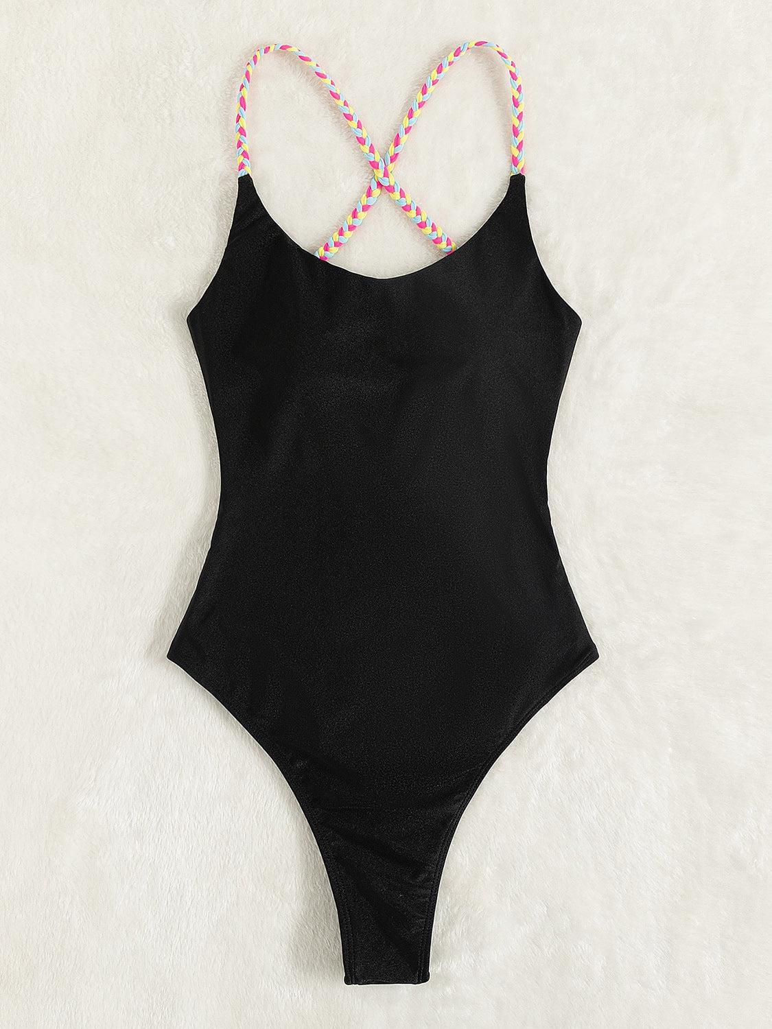 a black one piece swimsuit with pink and white beads