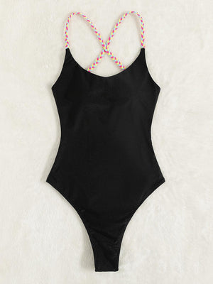 a black one piece swimsuit with pink and white beads
