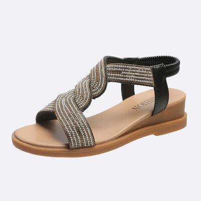 a women's sandal with a braided design