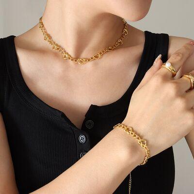 a woman wearing a gold chain bracelet