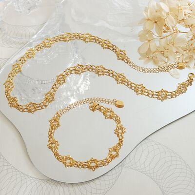 a white tray topped with a gold chain necklace