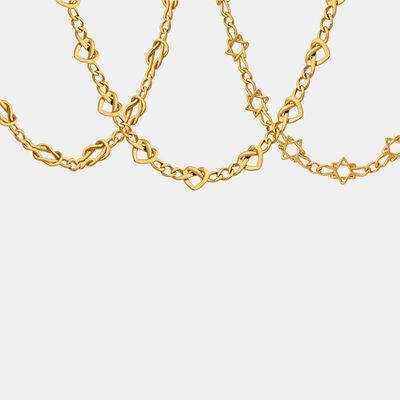 a close up of a gold chain on a white background