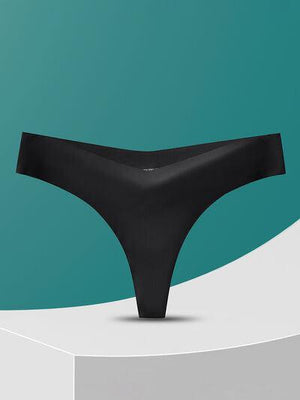 a pair of black underwear sitting on top of a table