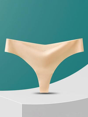 a white and beige object on a green background