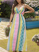 a woman in a colorful dress standing in a garden