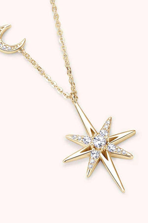 a gold necklace with a star and a crescent