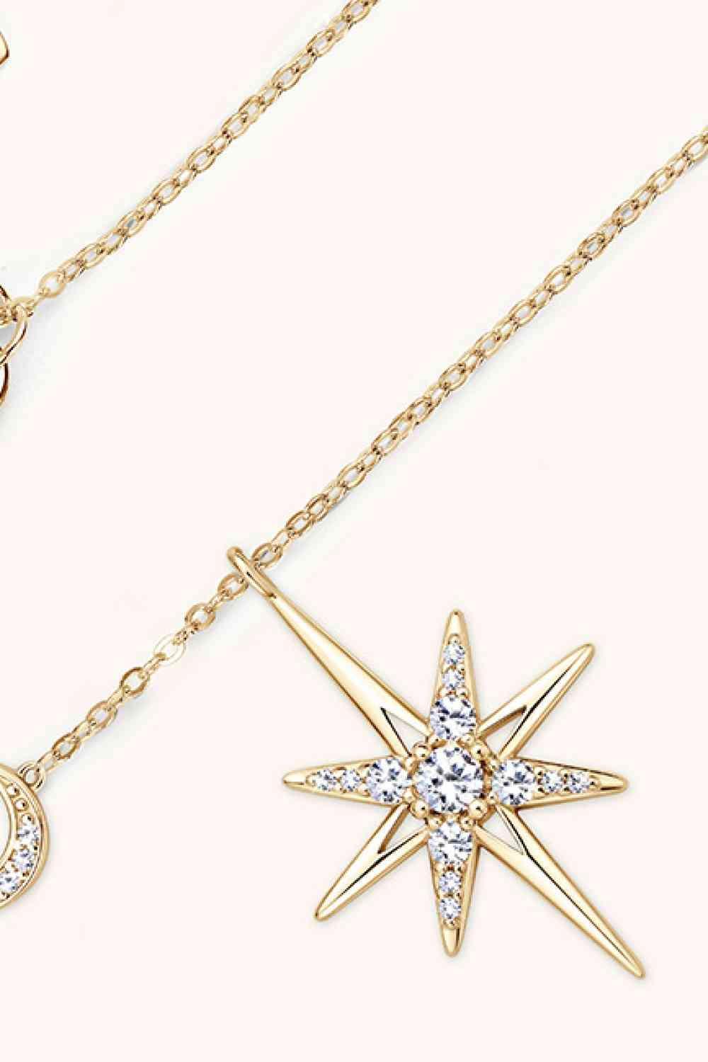 a gold necklace with a star and a crescent