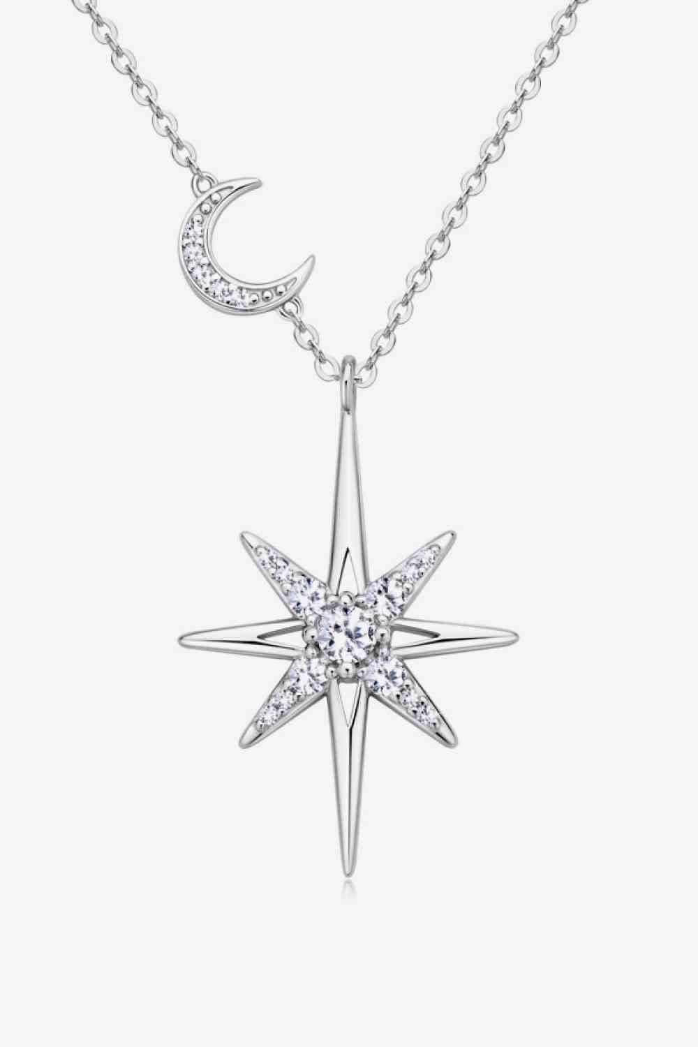 a necklace with a star and moon on it