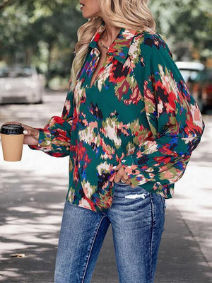 a woman holding a cup of coffee while standing on a sidewalk