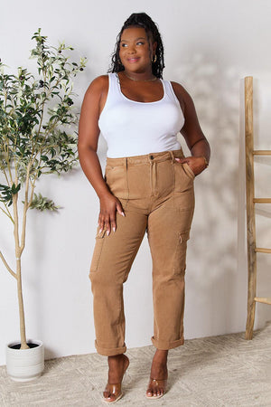 a woman in a white tank top and khaki pants