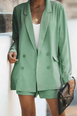 a woman wearing a green blazer and shorts