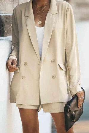 a woman wearing a tan blazer and shorts