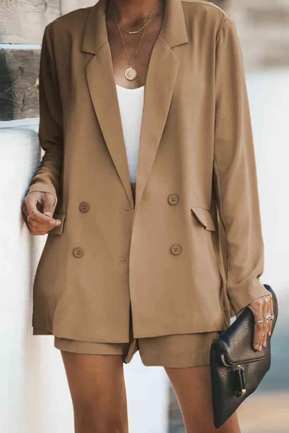 a woman wearing a tan blazer and shorts