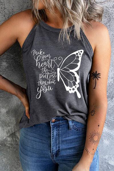 a woman wearing a tank top with a butterfly on it