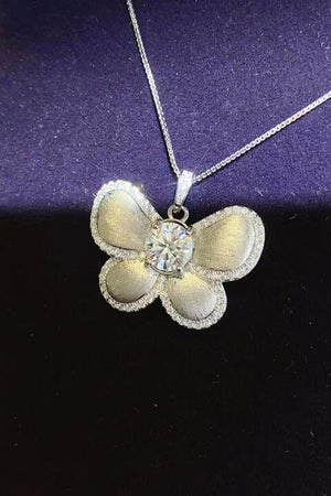 a necklace with a flower on it