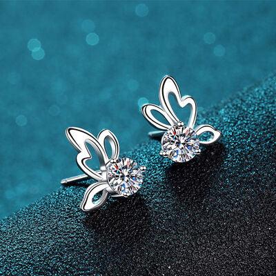 a pair of earrings with a flower design