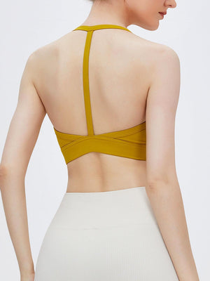 the back of a woman wearing a yellow top