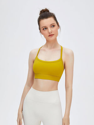 a woman in a yellow sports bra top
