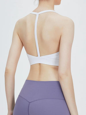 the back of a woman wearing a purple sports bra