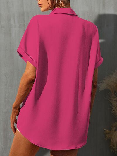 a woman wearing a pink shirt and shorts