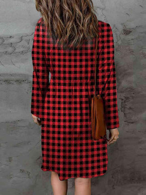 a woman in a red and black checkered dress