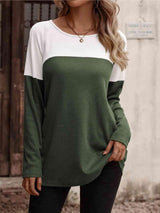 a woman wearing a green and white top