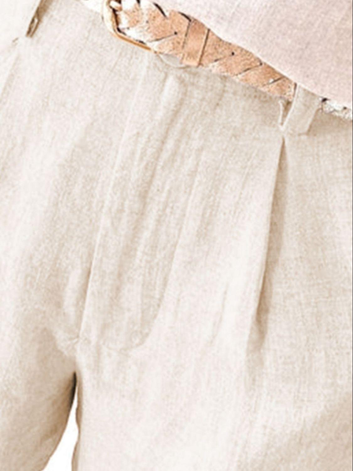 a close up of a person's pants with a belt