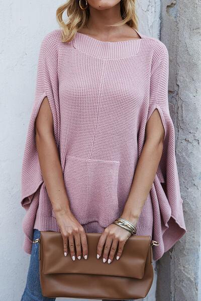 a woman in a pink sweater holding a brown purse