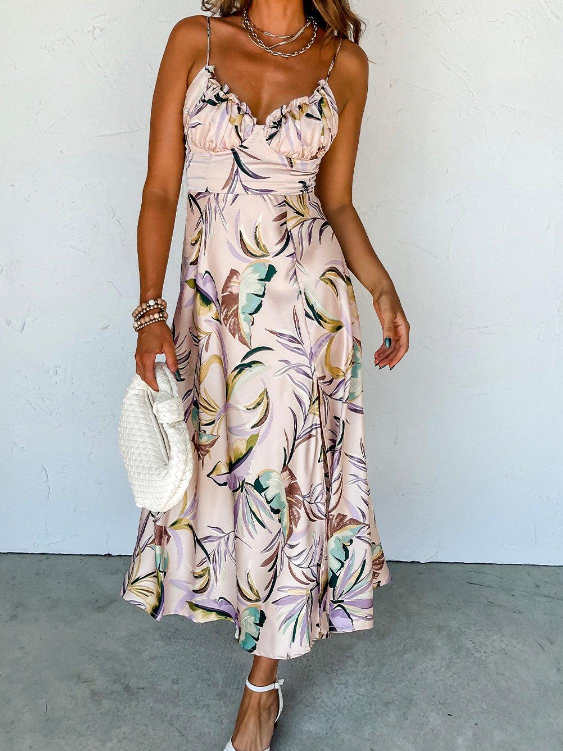 a woman in a floral print dress holding a white purse