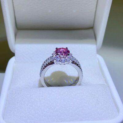 a pink diamond ring in a white box