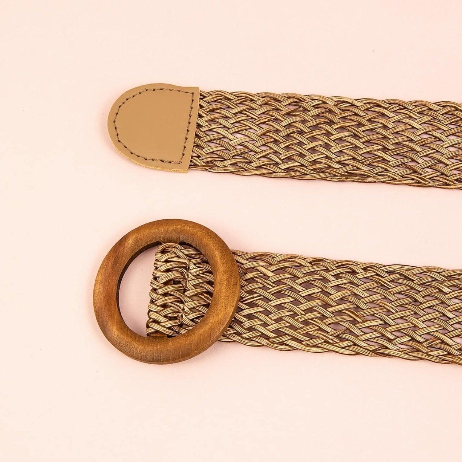 a pair of wooden watches straps on a pink background