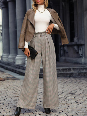 a woman standing on a cobblestone street