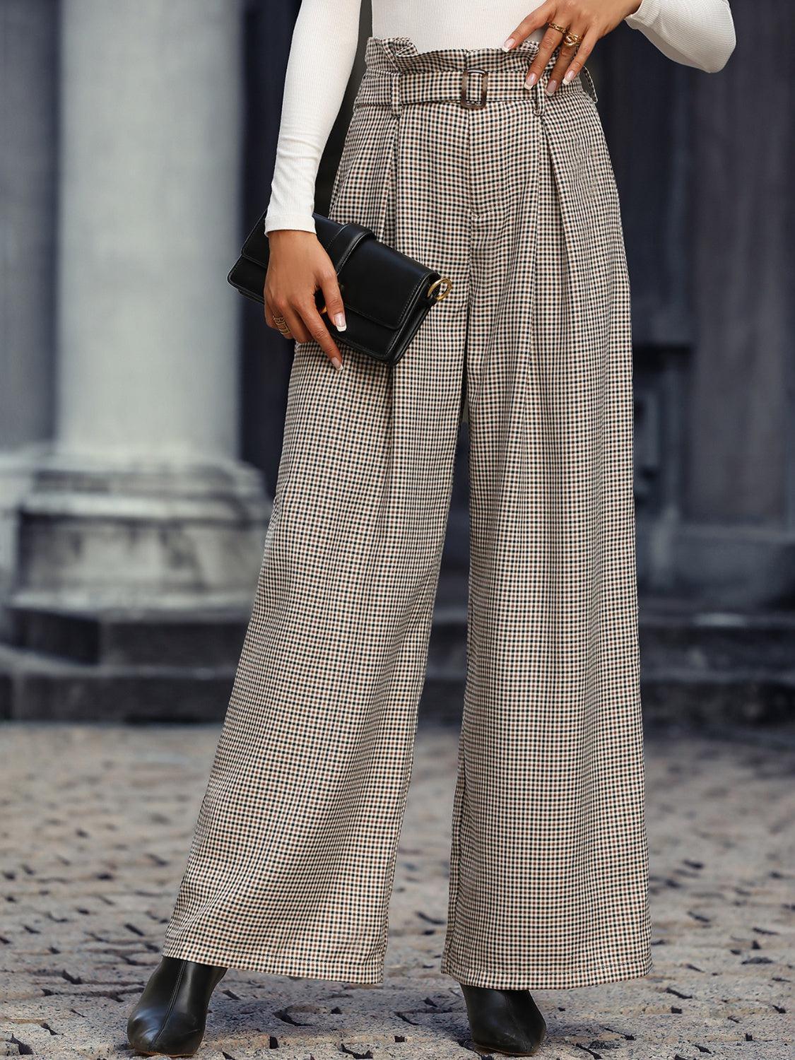 a woman in a white shirt and checkered pants