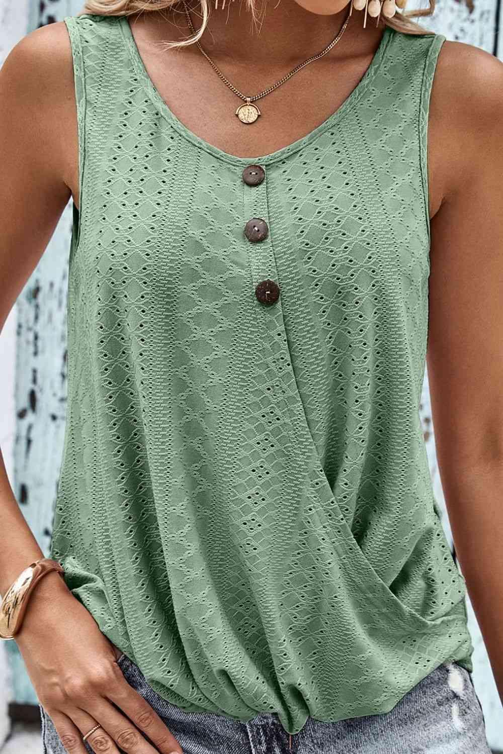 a woman wearing a green tank top