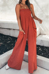 a woman in a red jumpsuit posing for a picture