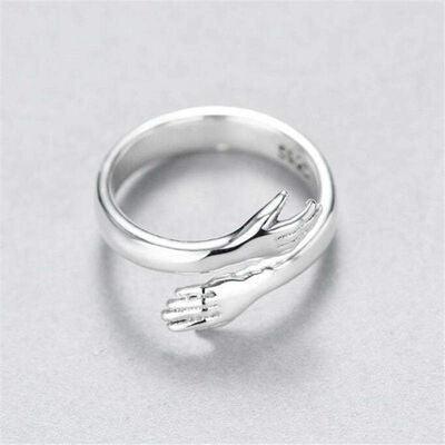 a silver ring with a bird on it