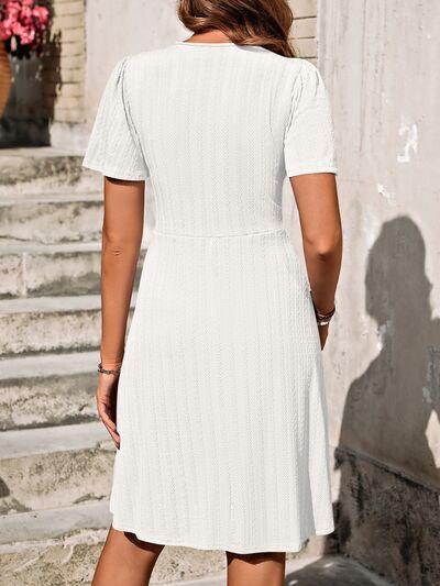 a woman in a white dress is walking down some steps