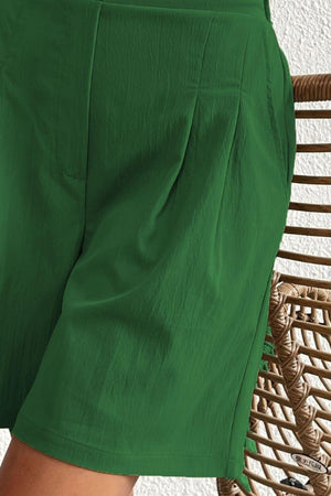 a close up of a person wearing green shorts