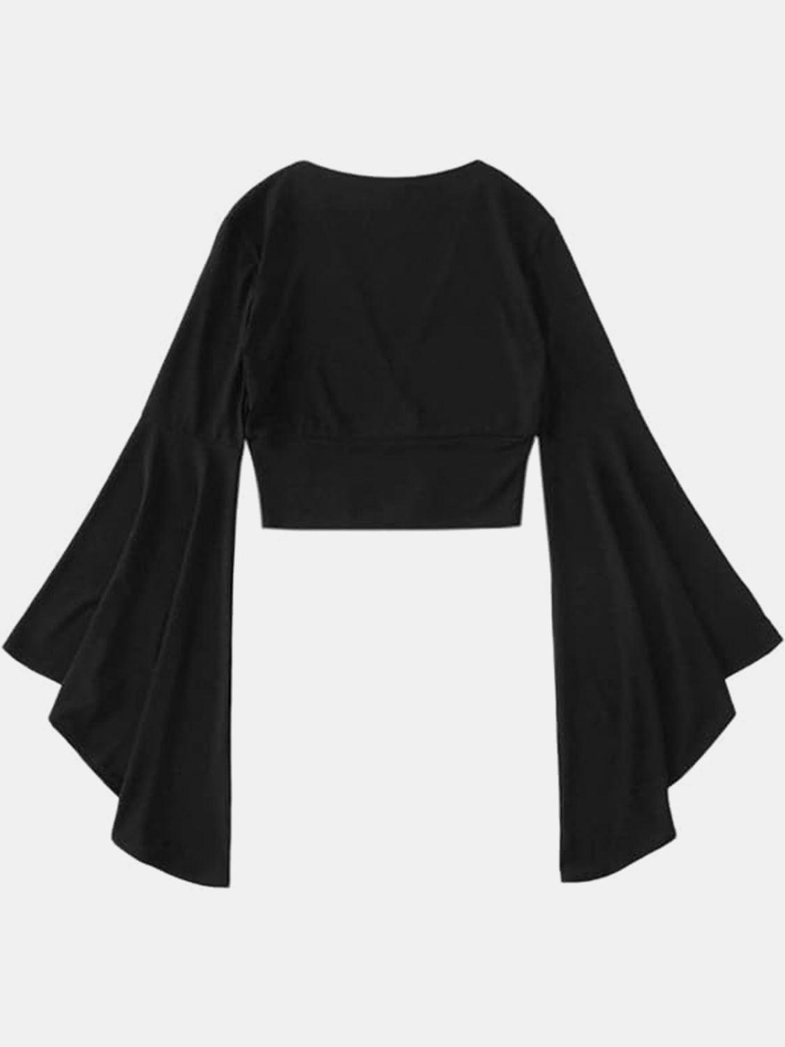 a cropped black top with bell sleeves