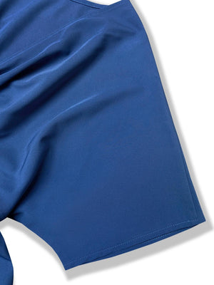 a close up of a blue shorts on a white background