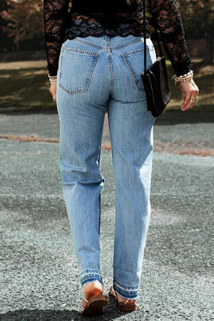 a woman walking down a street holding a purse