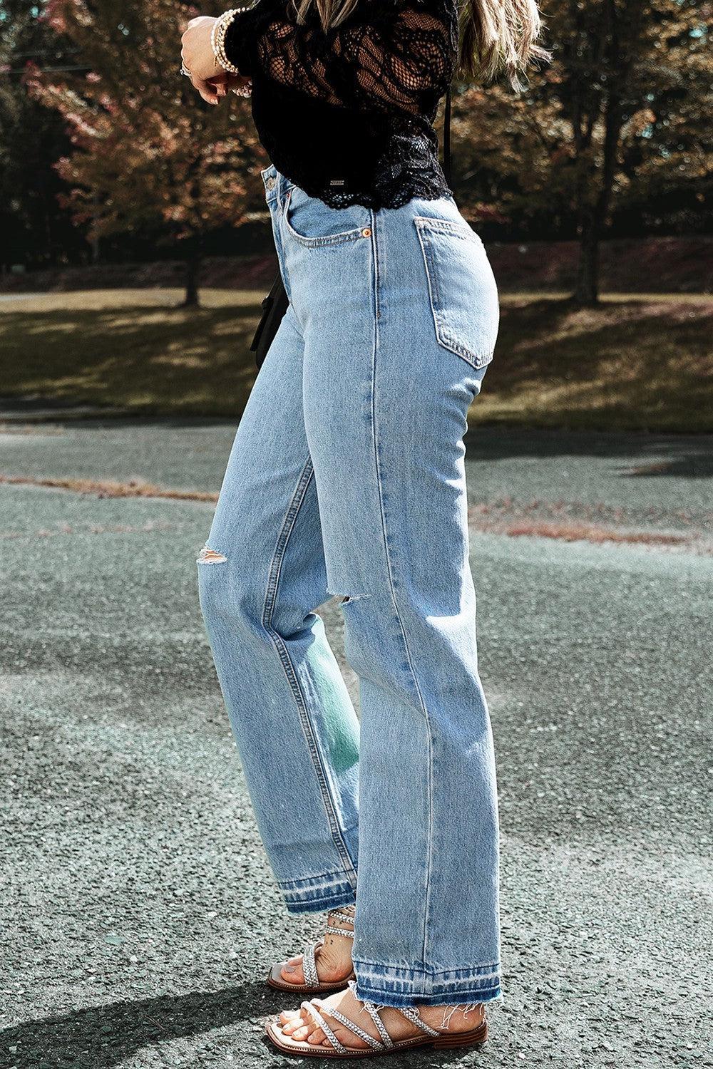 a woman riding a skateboard down a street